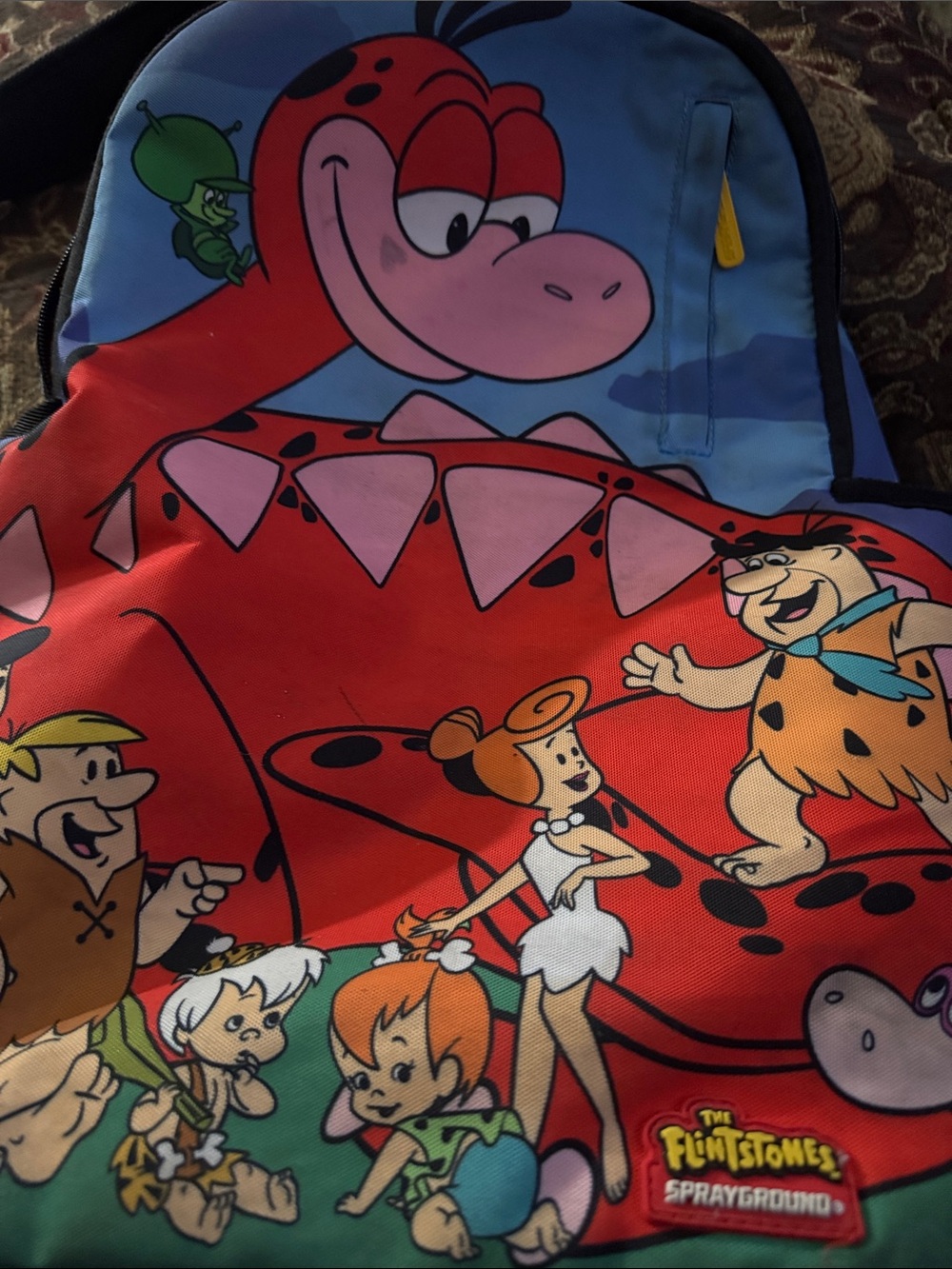 Sprayground The Flintstones Cartoon Backpack - Red, Blue & Pink